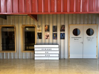 Posters for the South Screens Festival hanging on the walls of Metropolis. April 20, 2024. (Mahdi El Amin/Raseef22)